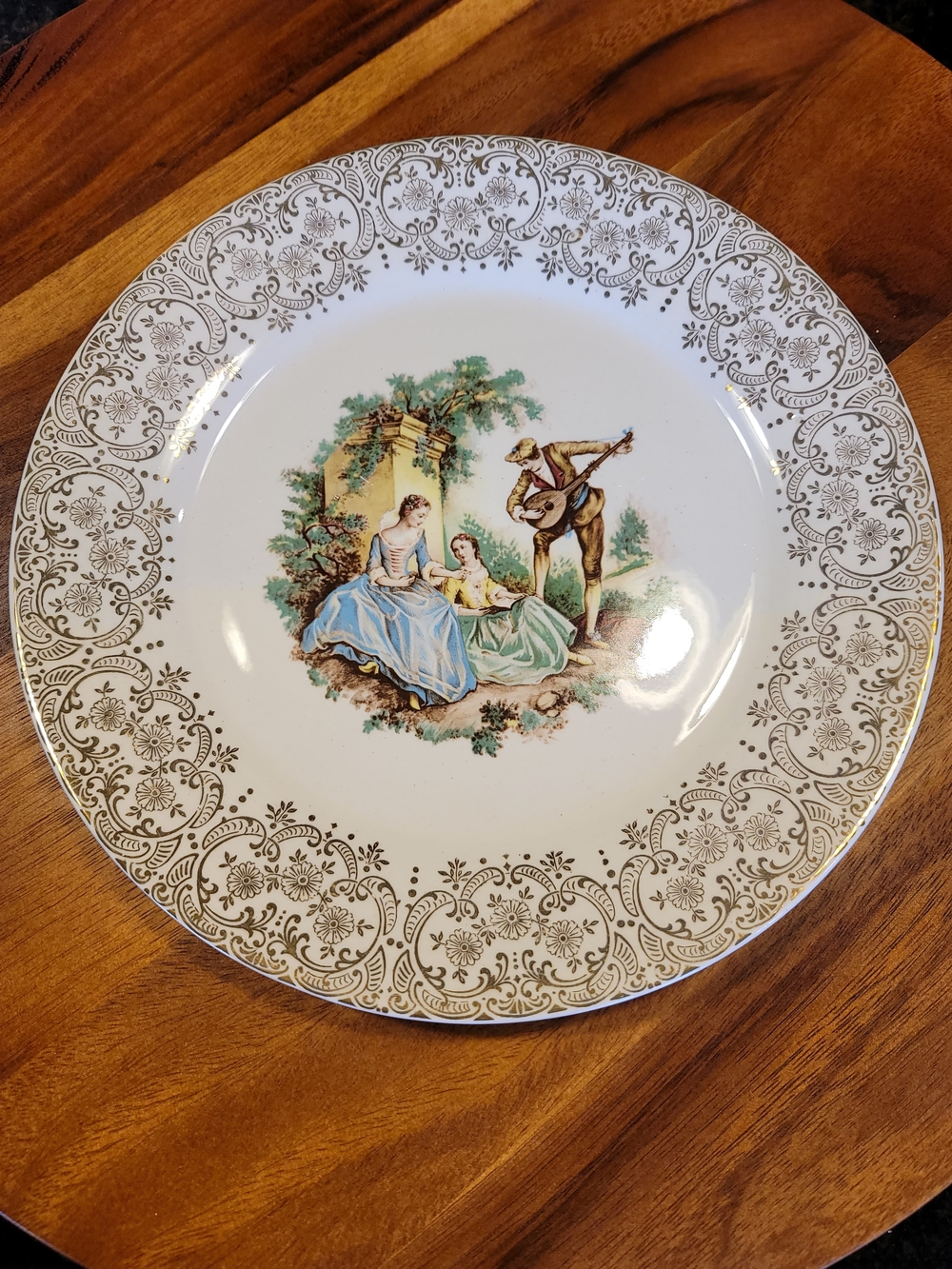 Triumph Porcelain Dinner Plate in White with Gold and Pastel Scene